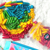 Vibrant colorful pasta filler for sensory play, featuring various shapes and shades. Ideal for sensory bins, tactile exploration, and creative activities for toddlers and kids